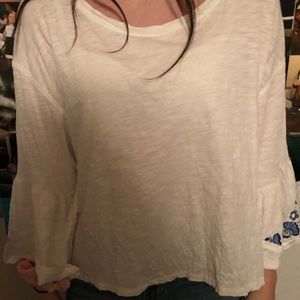 Long sleeve, light, floral shirt.